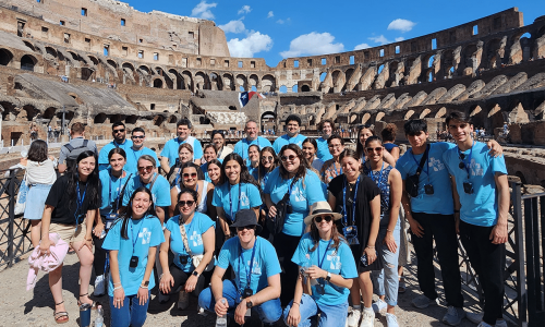 A group on pilgrimage at the Roman Colosseum