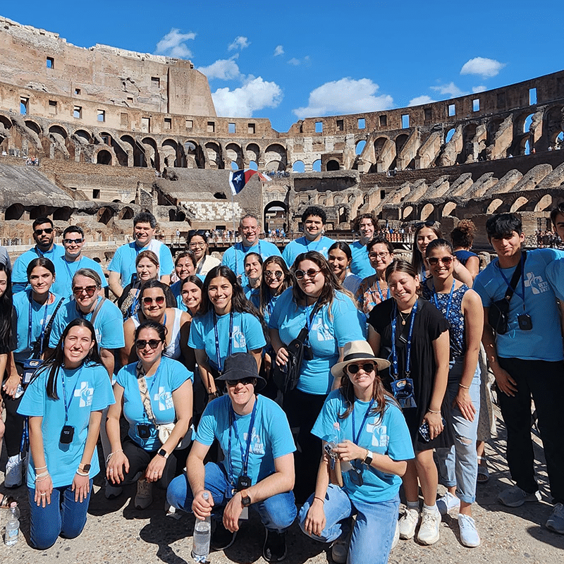 A group on pilgrimage at the Roman Colosseum