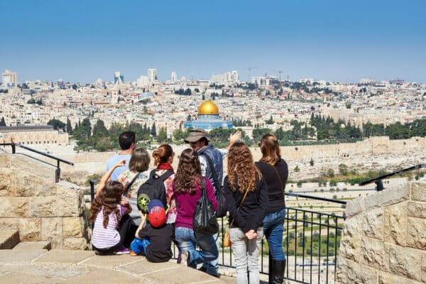 A group of pilgrims overlooking the city of Jerusalem.