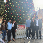 Nativity CEO Khaled Jacoub and family in front of the Christmas Tree, Manger Square in Bethlehem