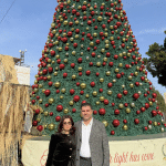 Nativity CEO Khaled Jacoub and wife Yara in front of the Christmas Tree, Manger Square in Bethlehem