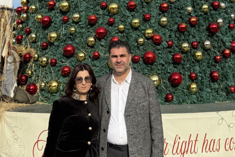 Nativity CEO Khaled Jacoub and wife Yara in front of the Christmas Tree, Manger Square in Bethlehem