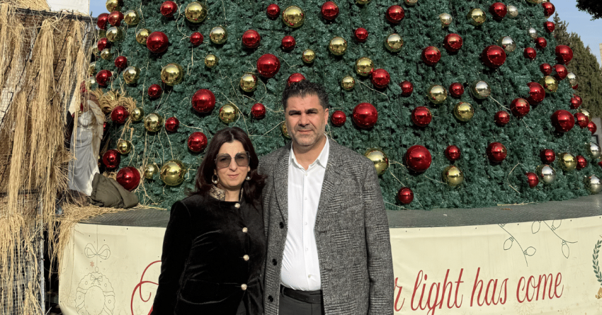 Bethlehem Tree Nativity CEO Khaled Jacoub and wife Yara in front of the Christmas Tree, Manger Square in Bethlehem