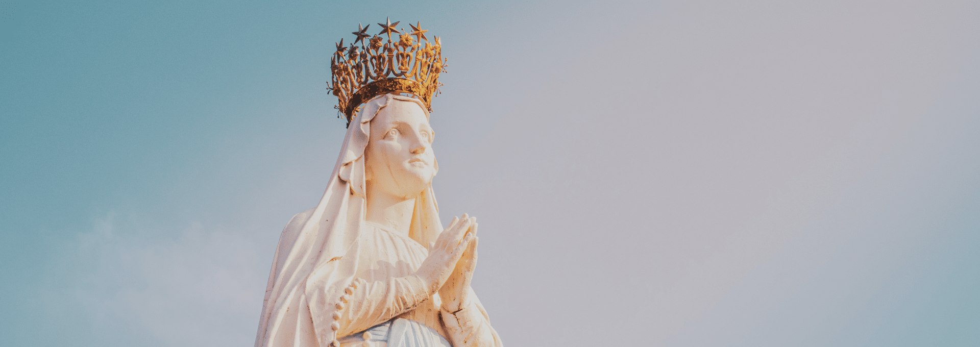 Sculpture of the crowned Virgin Mary at the Sanctuary of Lourdes in the Pyrenees region of France. A popular place of pilgrimage for Christians, especially Catholics.